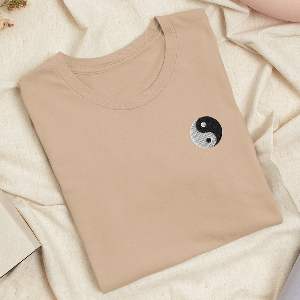 a t - shirt with a yin symbol on it