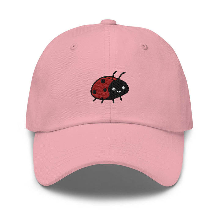 a pink hat with a ladybug embroidered on it