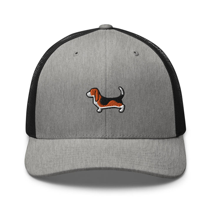 a gray and black trucker hat with a dog embroidered on the front