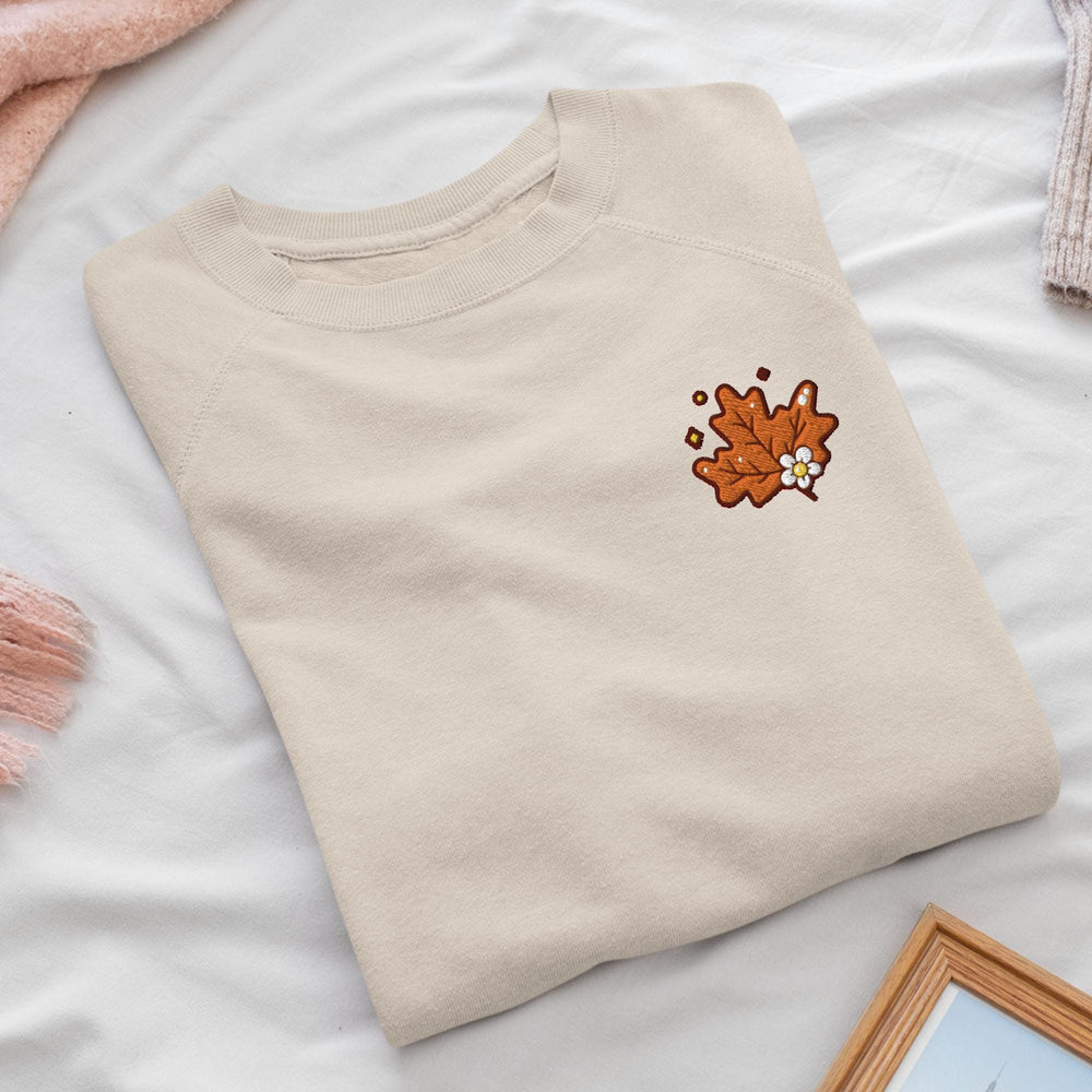 a t - shirt with a picture of a flower on it