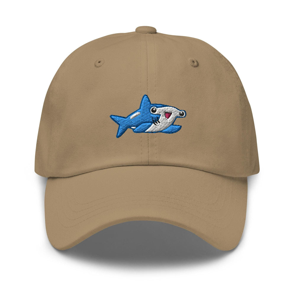 a tan hat with a shark embroidered on it