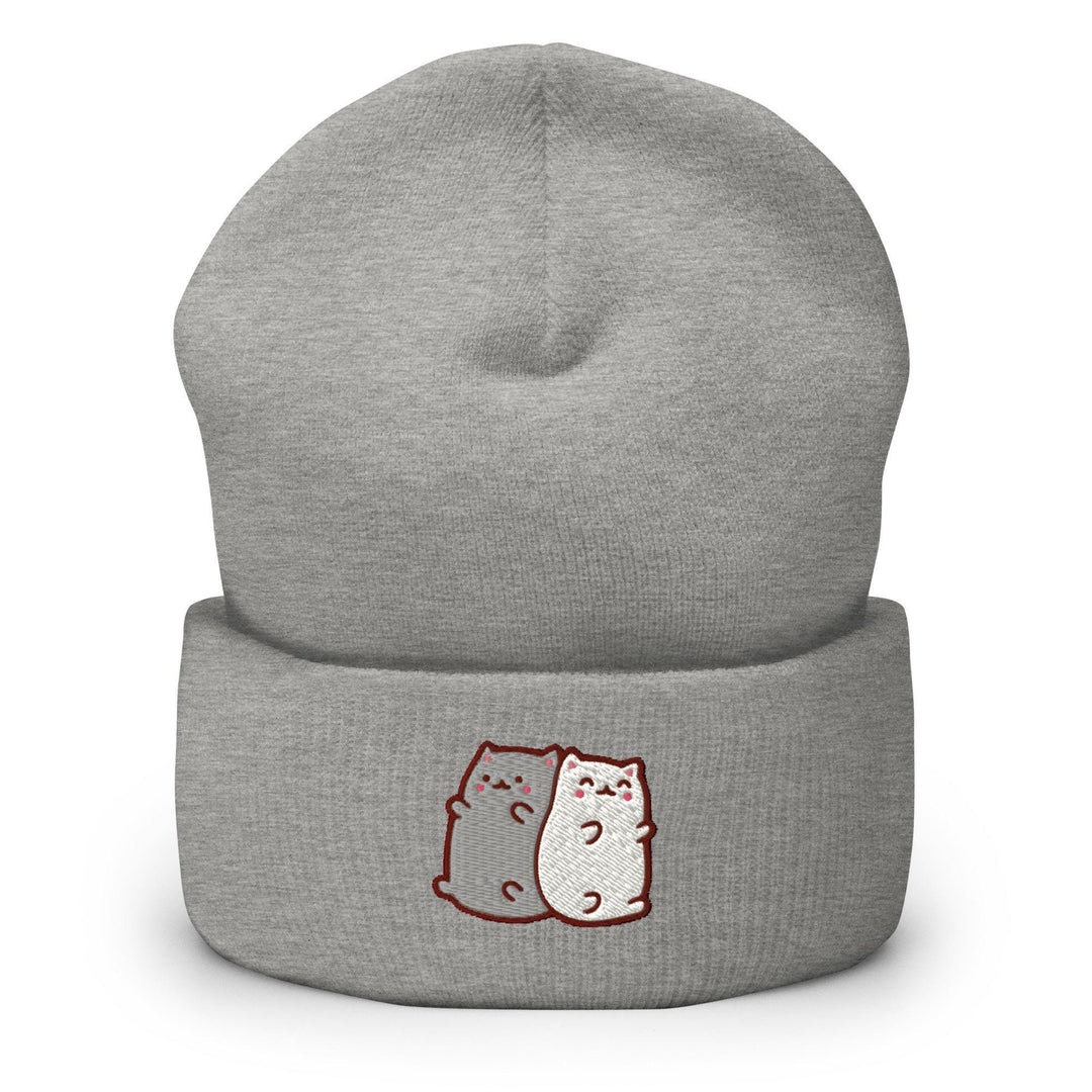 a grey beanie with two cats on it
