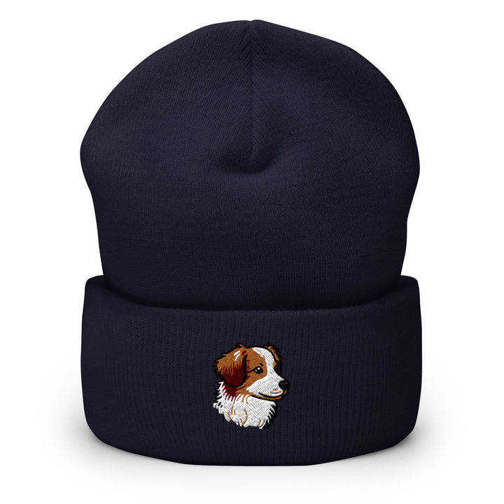 a black beanie with a brown and white dog on it