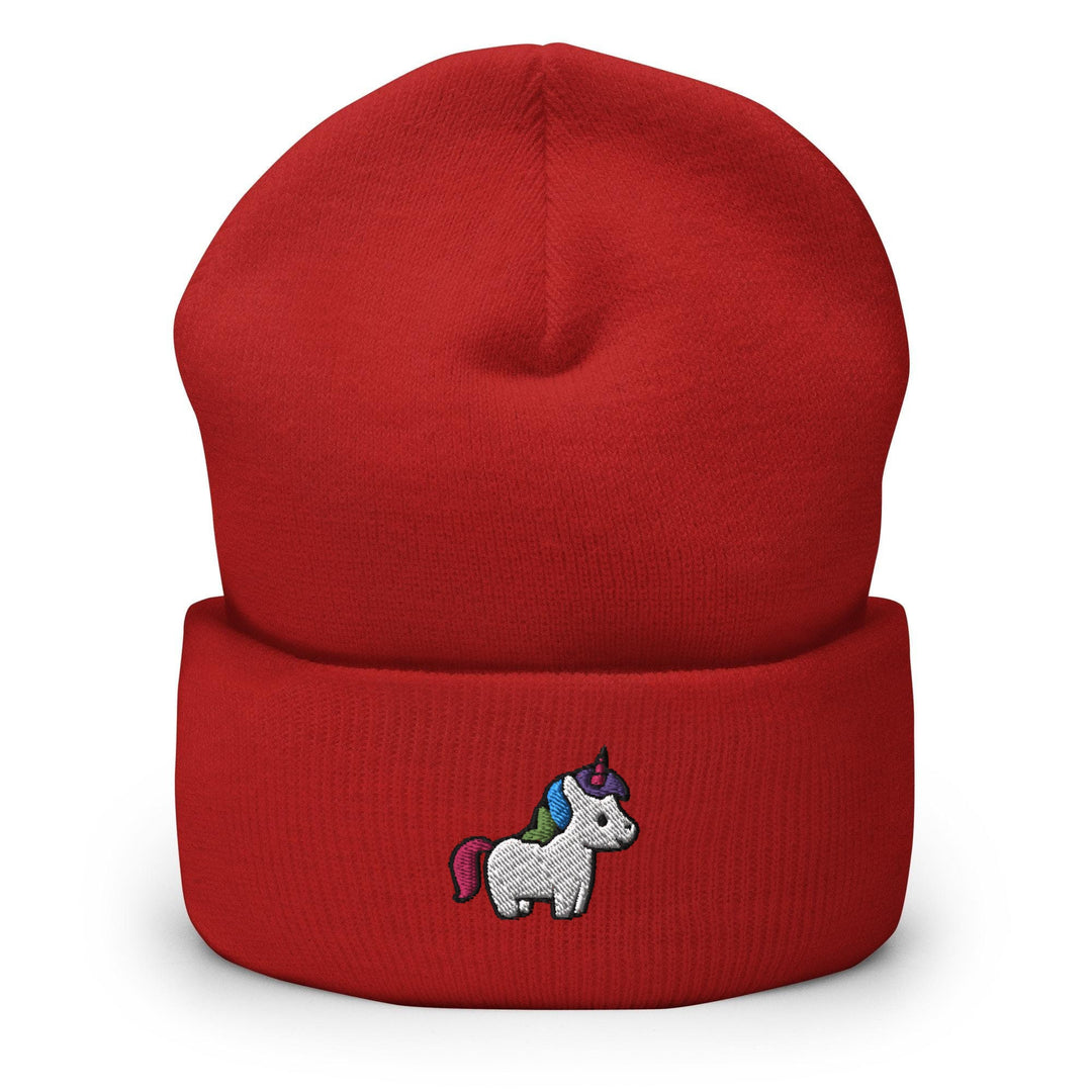 a red beanie with a unicorn embroidered on it