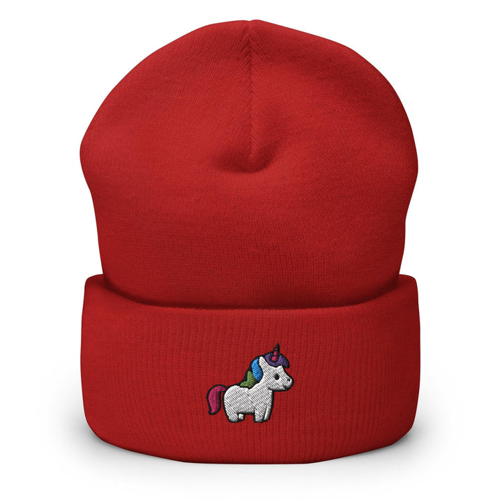 a red beanie with a unicorn embroidered on it