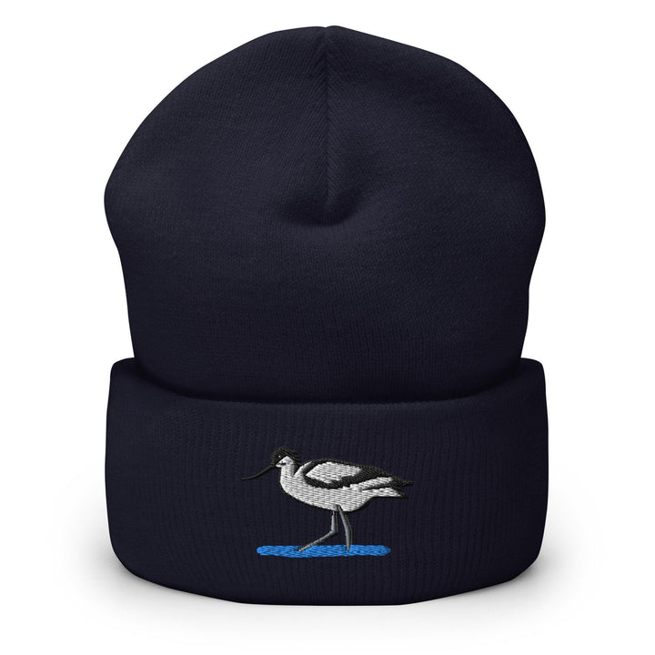 a black beanie with a white bird on it