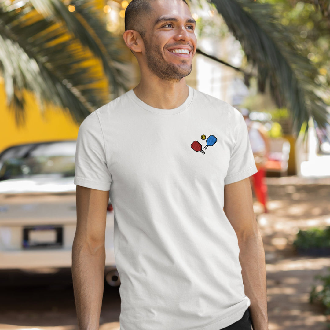 a man in a white t - shirt is smiling