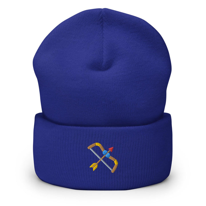 a blue beanie with a pair of scissors on it