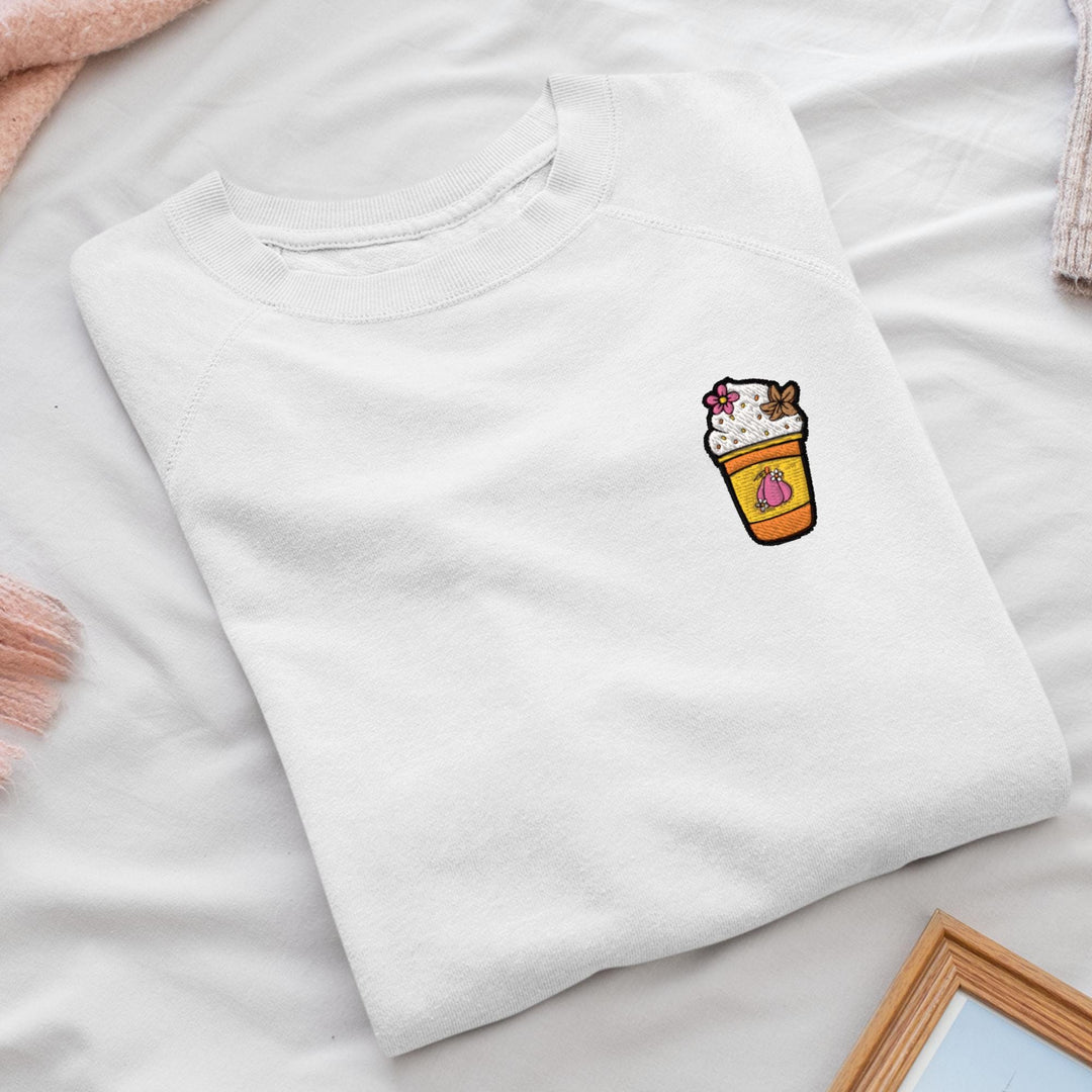 a white t - shirt with a picture of a cup of coffee on it