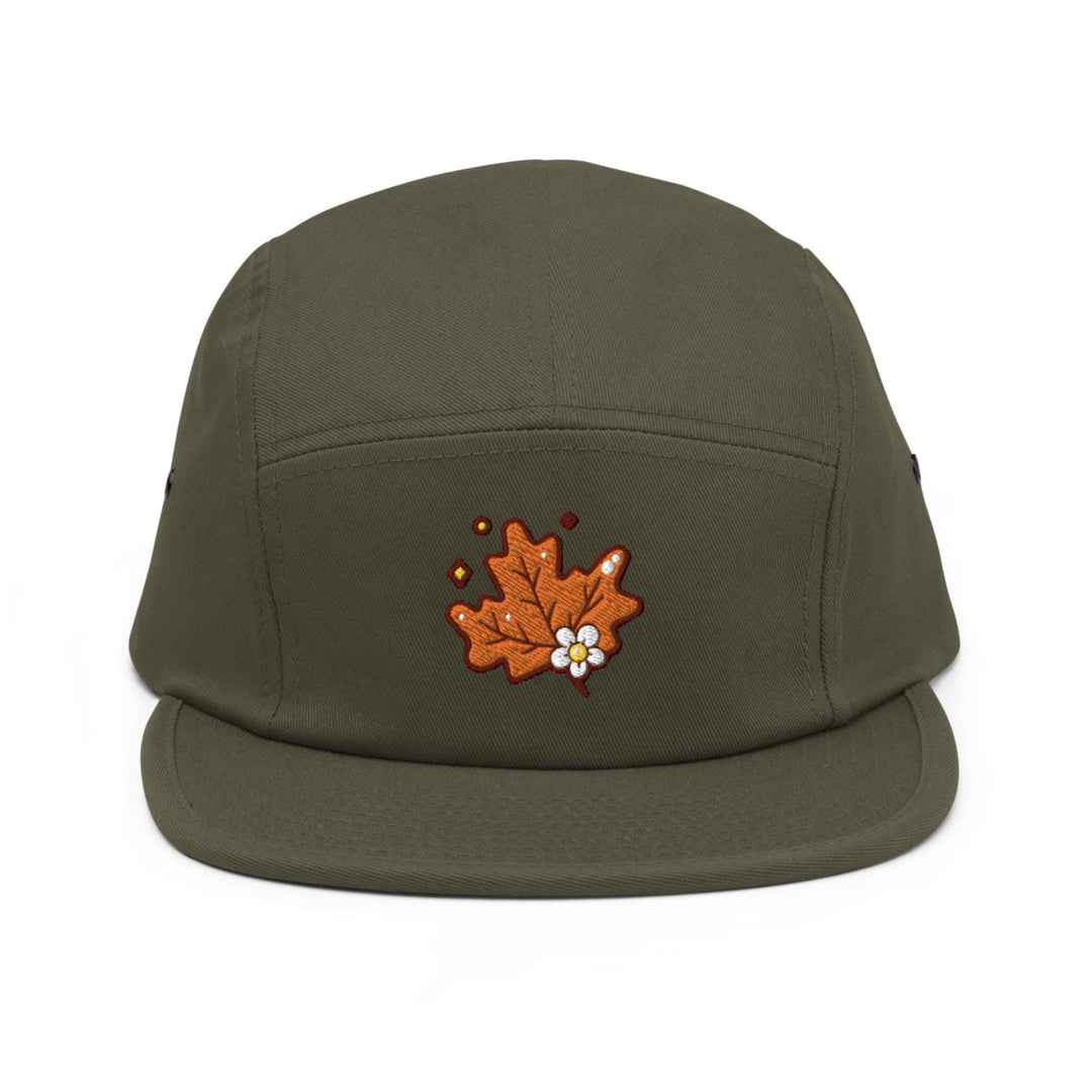 a green hat with a flower embroidered on it