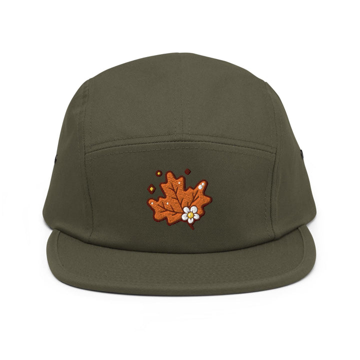 a green hat with a flower embroidered on it