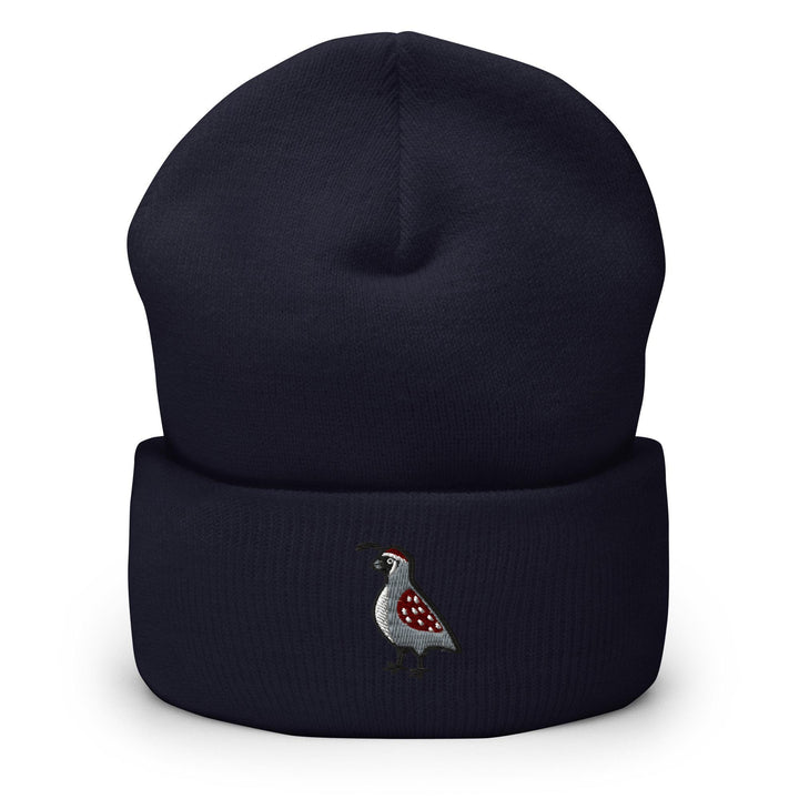 a blue beanie with a bird embroidered on it