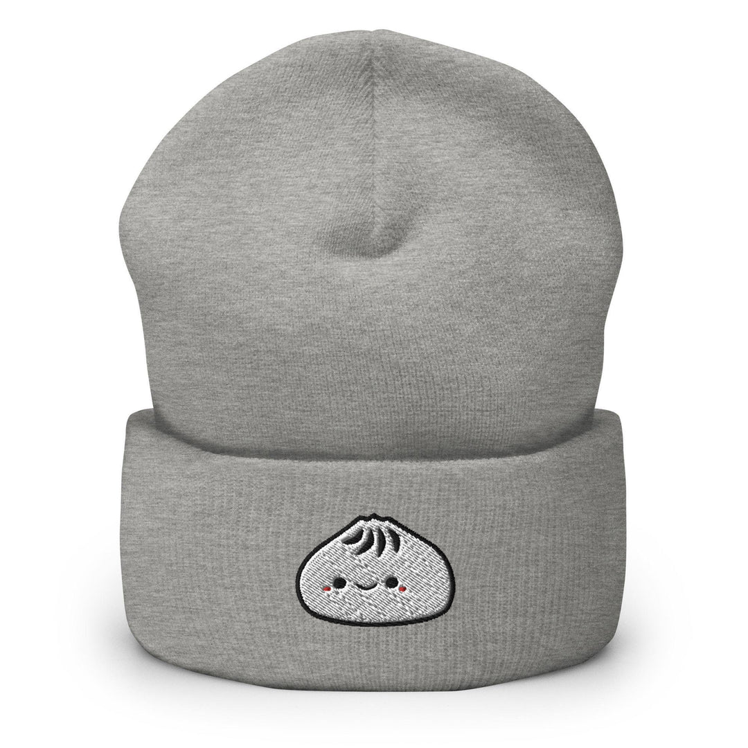 a grey beanie with a white face on it