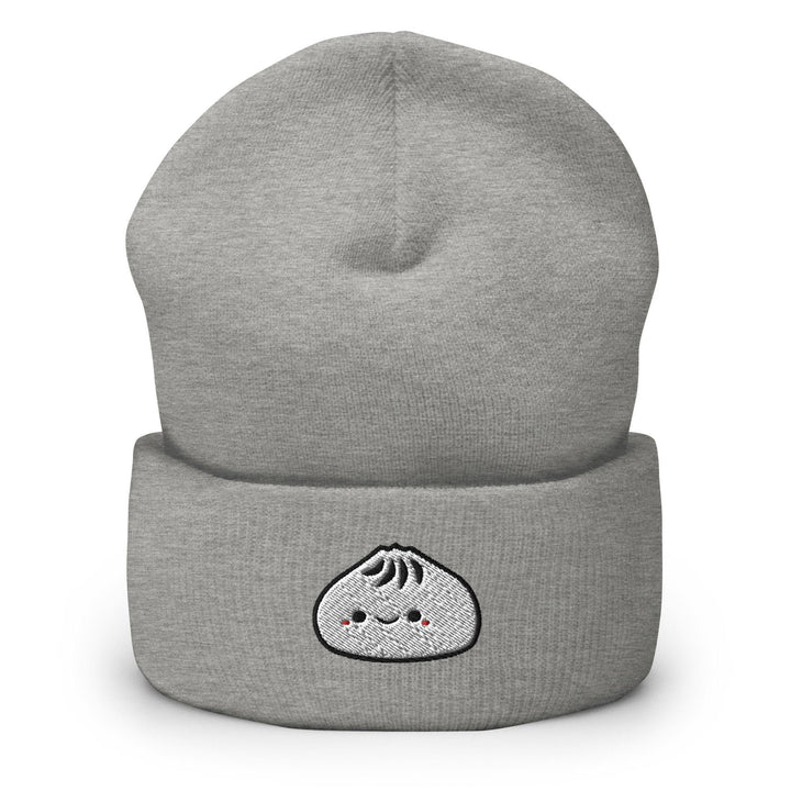 a grey beanie with a white face on it