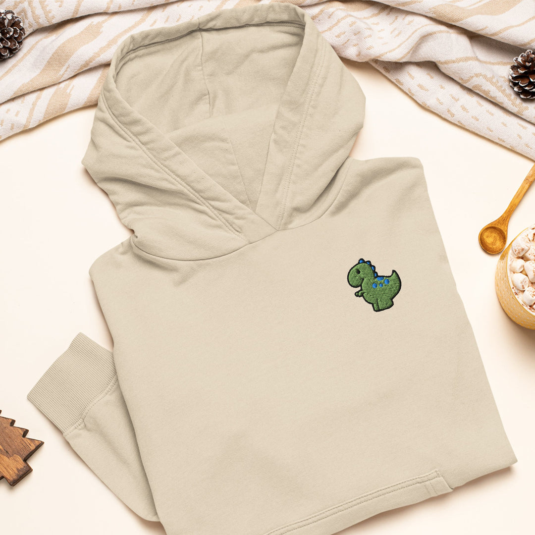 a white hoodie with a green dinosaur embroidered on it