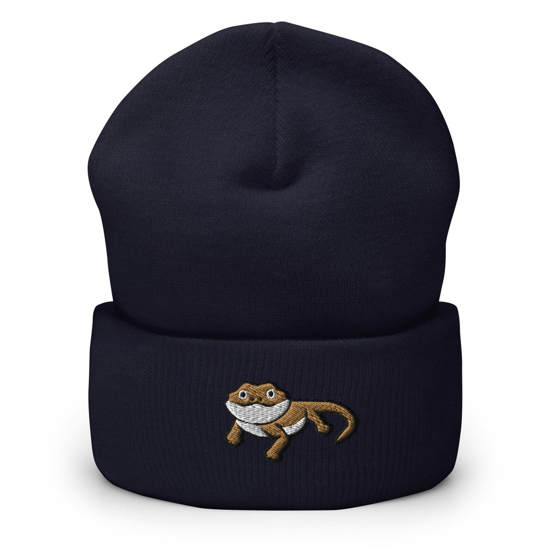 a blue beanie with a cartoon cat on it