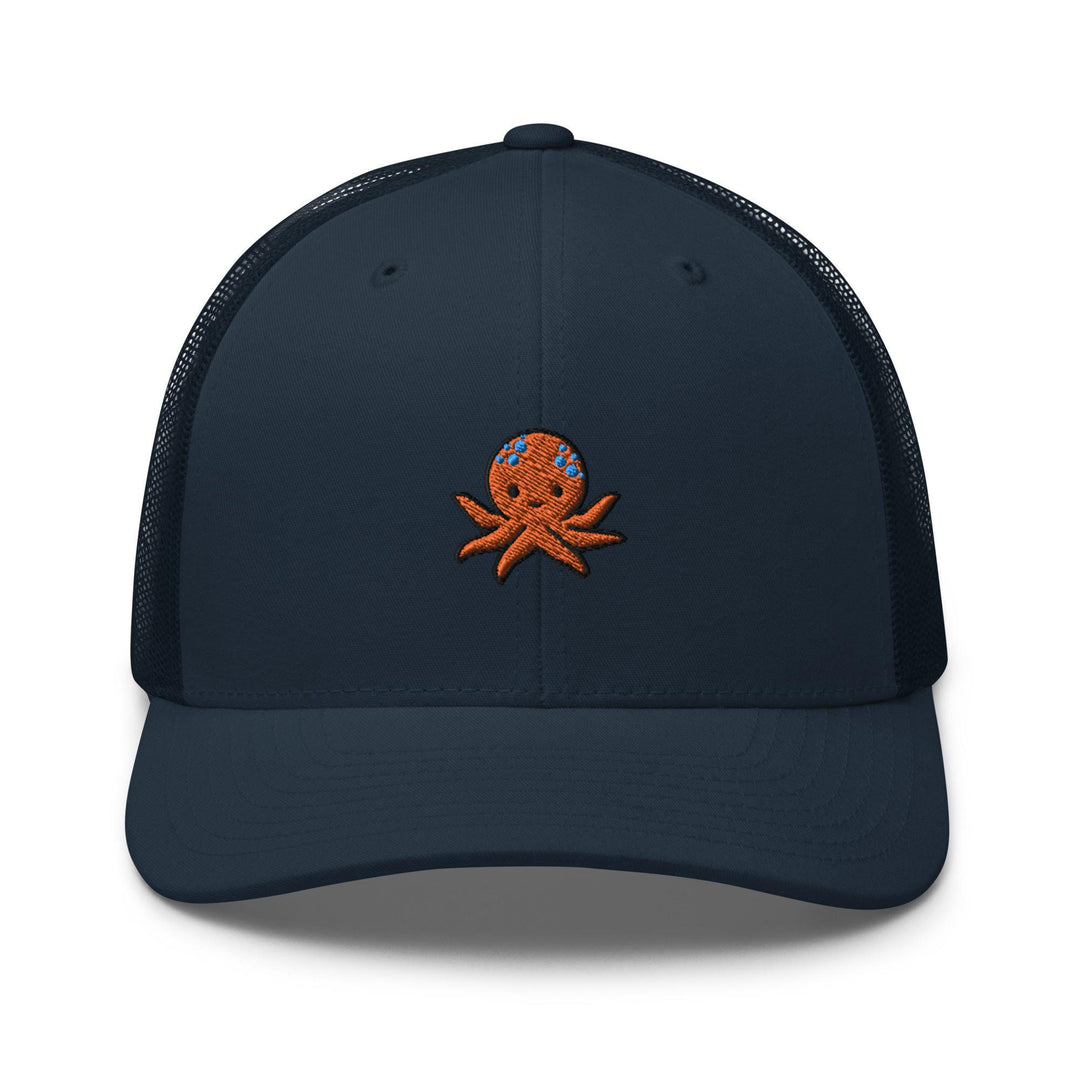 a blue hat with an octopus embroidered on the front