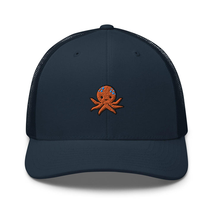 a blue hat with an octopus embroidered on the front