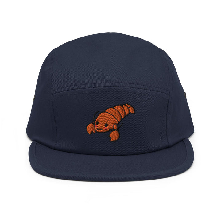 a blue hat with an orange fish embroidered on it