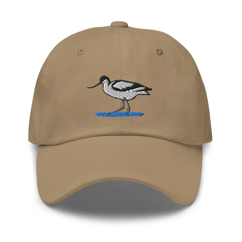 a tan hat with a bird embroidered on it
