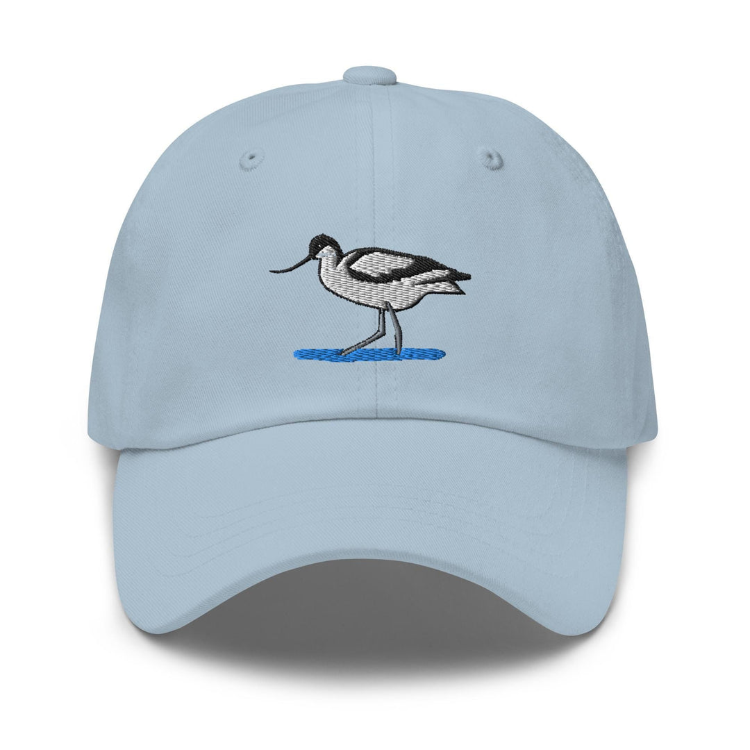 a light blue hat with a bird embroidered on it