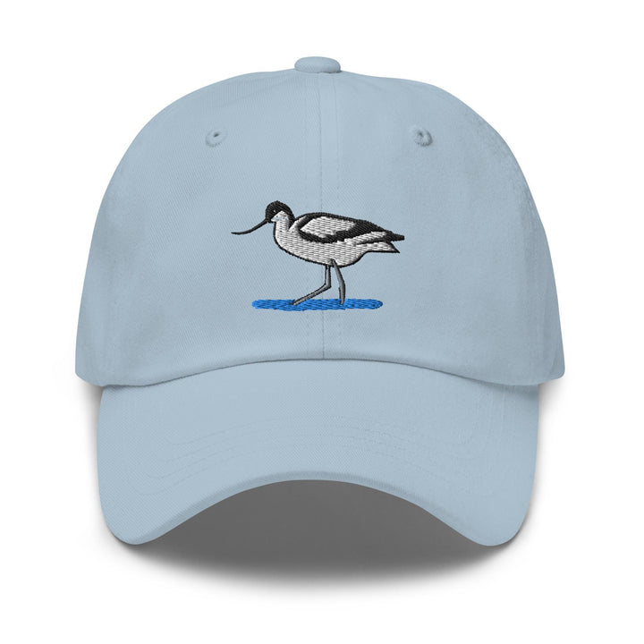 a light blue hat with a bird embroidered on it