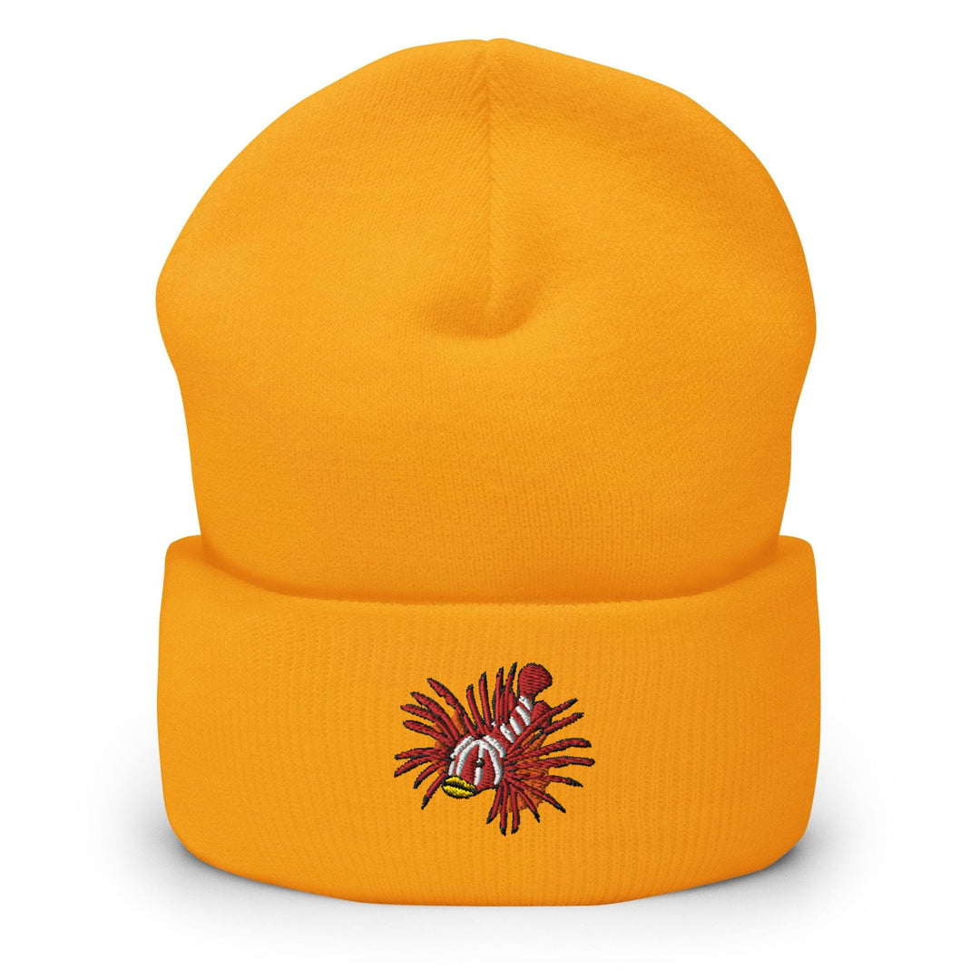 a yellow beanie with a picture of a fish on it
