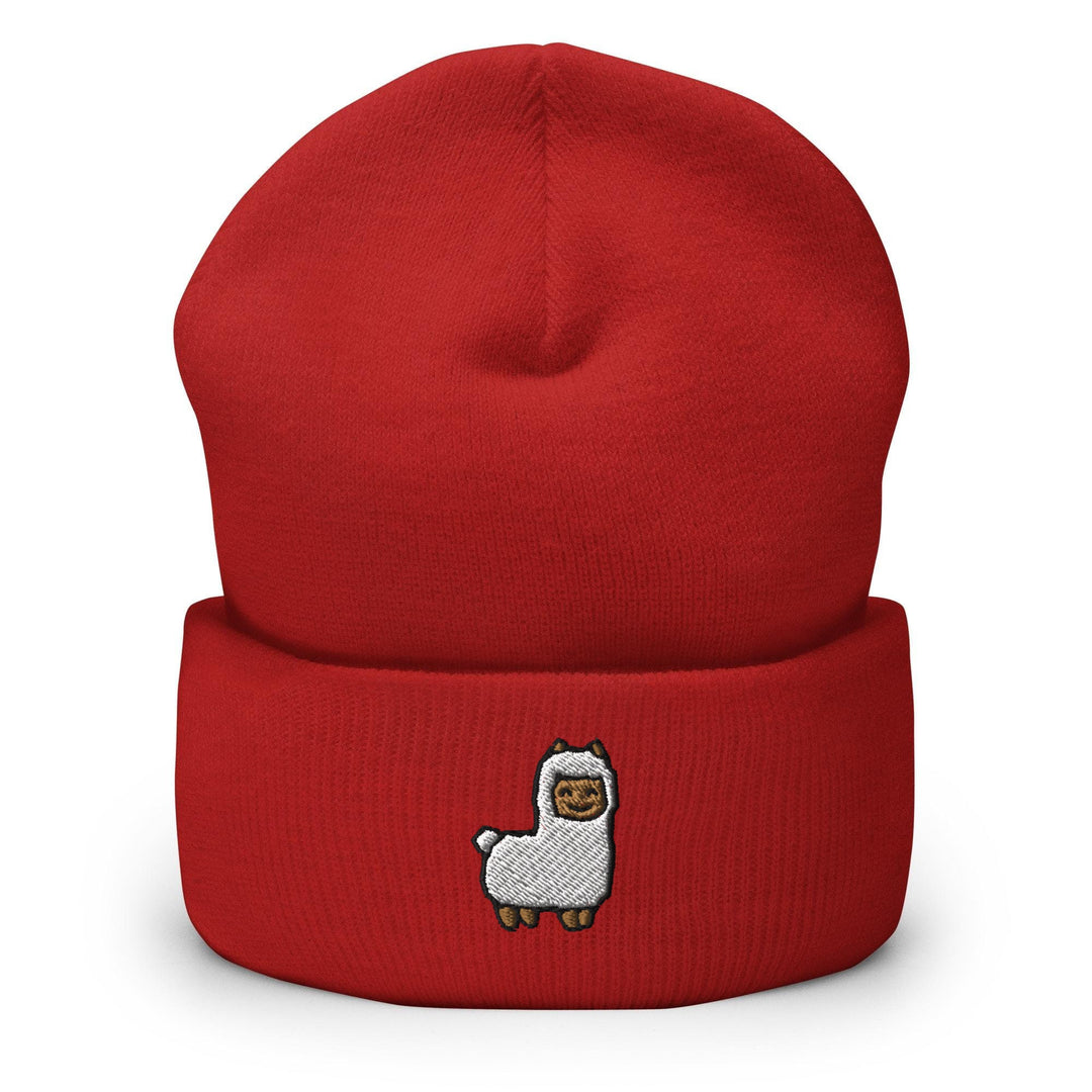 a red beanie with a white llama on it