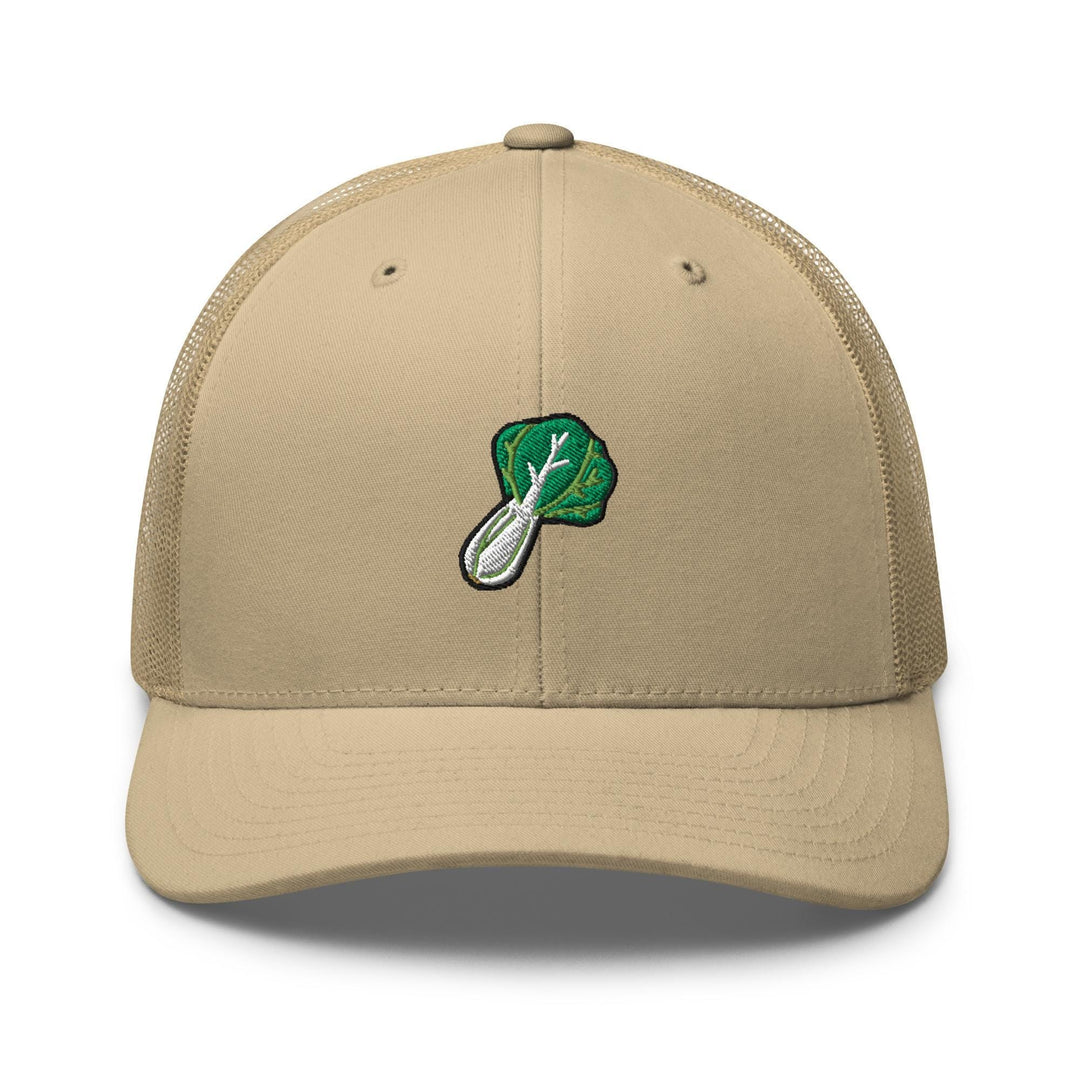 a tan trucker hat with a green leaf on it