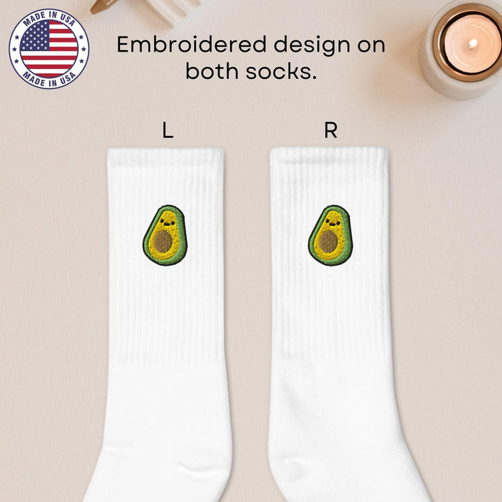 a pair of socks with an avocado on them