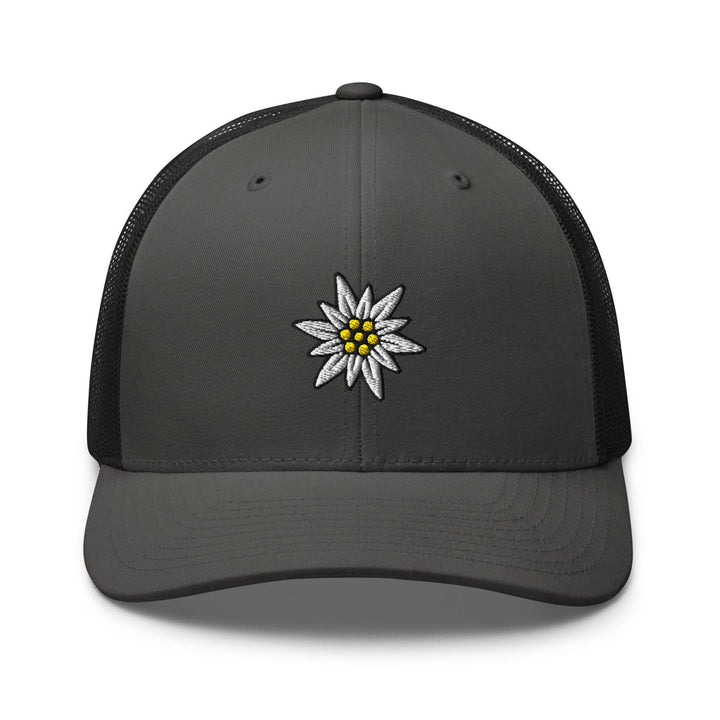a gray and black trucker hat with a daisy on the front
