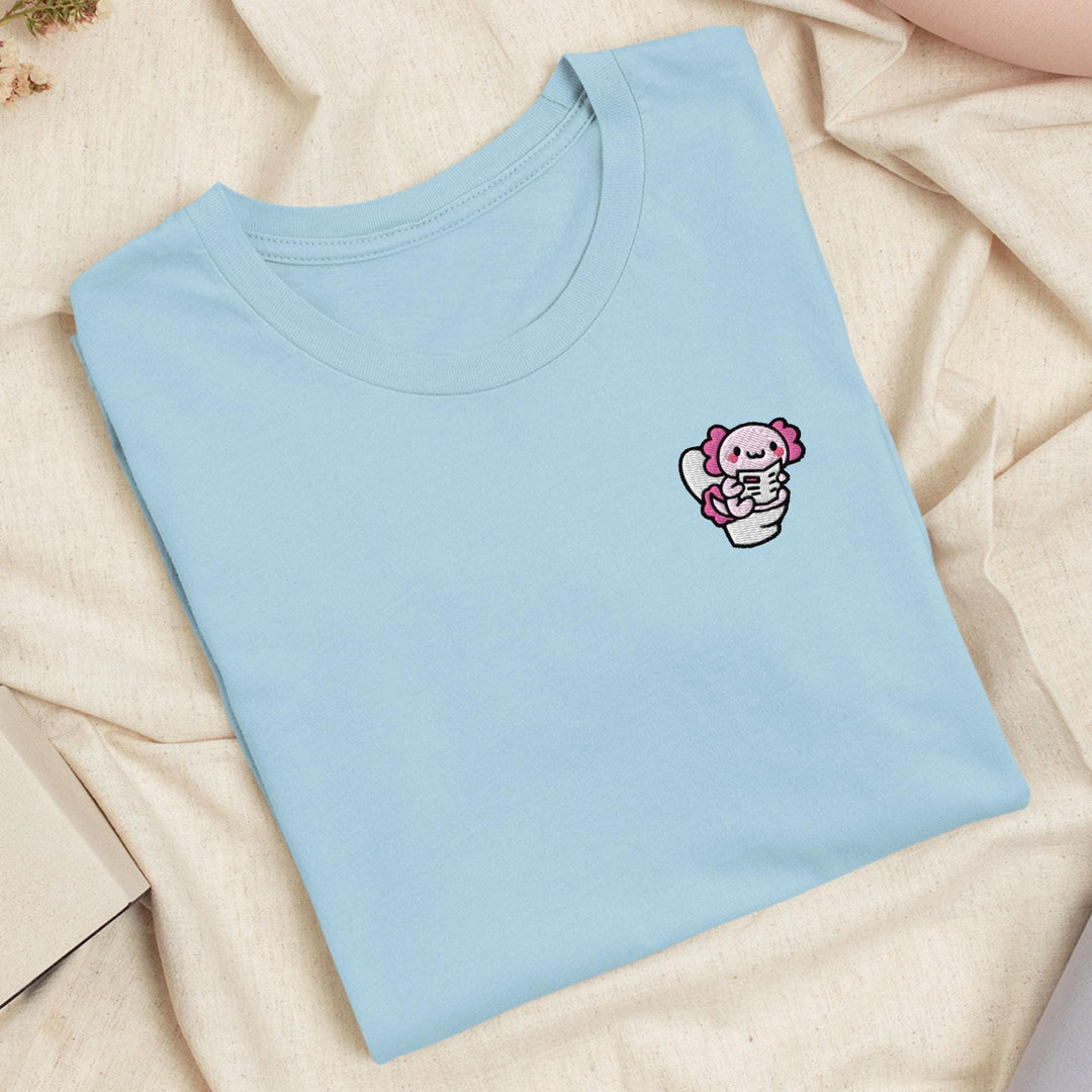 a blue t - shirt with a pink teddy bear on it