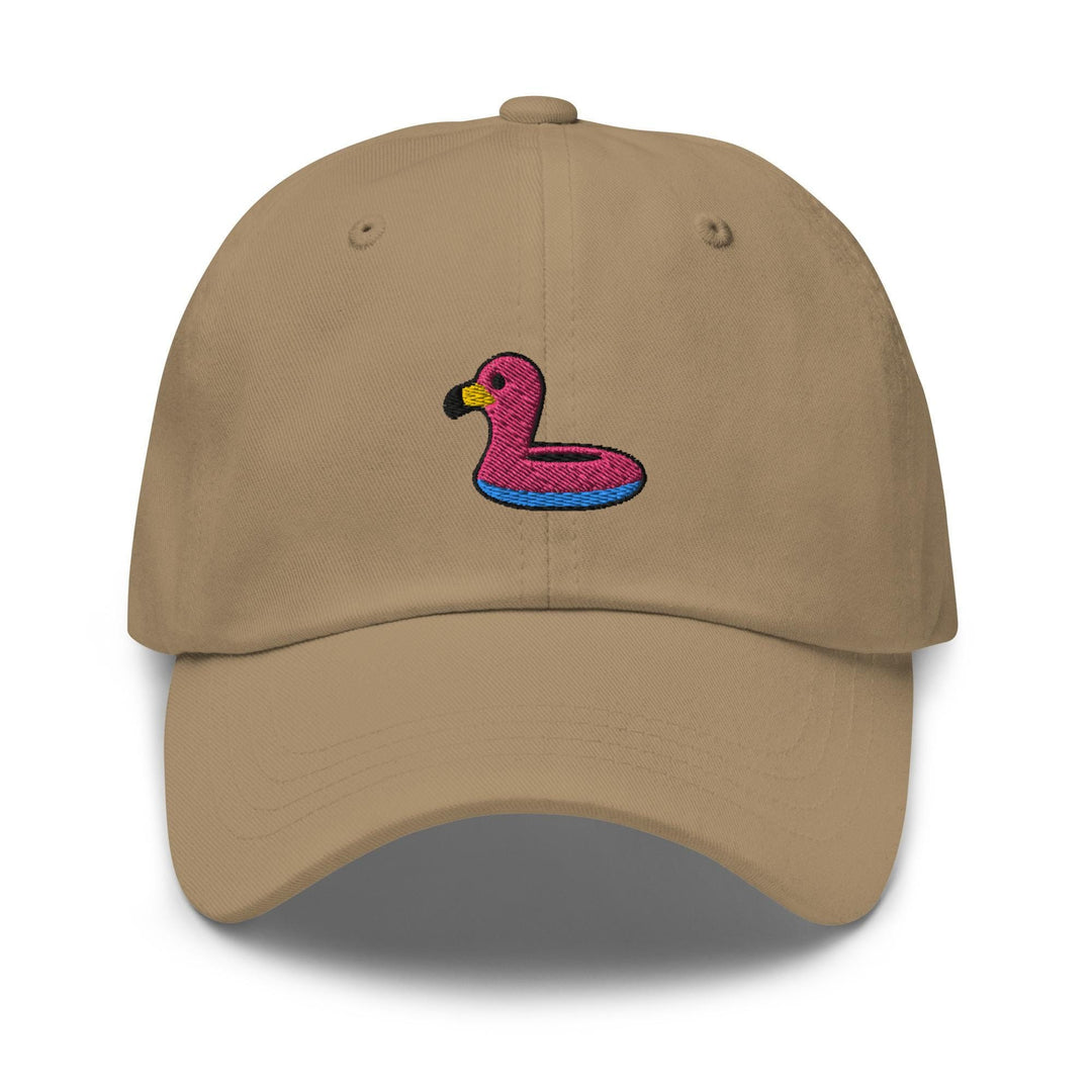 a tan hat with a pink flamingo embroidered on it