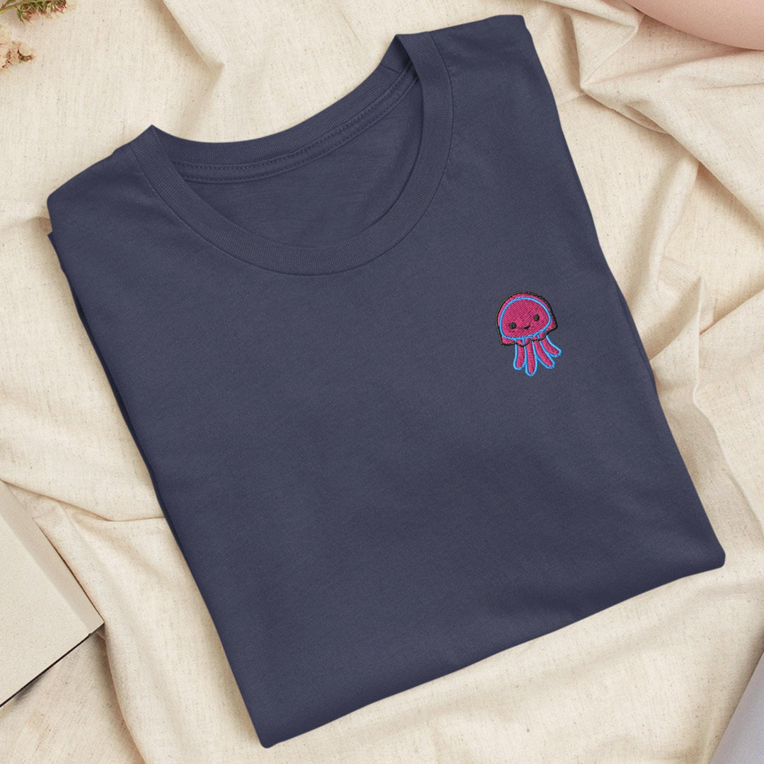 a blue t - shirt with a pink jellyfish embroidered on it