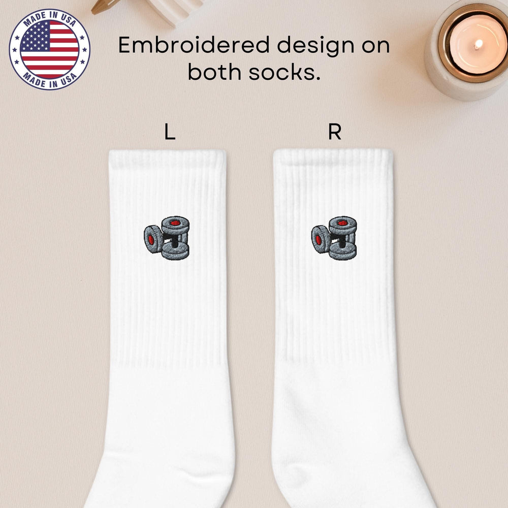 a pair of white socks with a camera on them