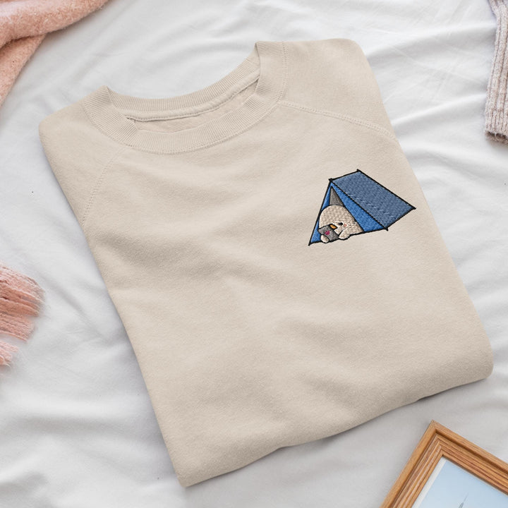 a t - shirt with a picture of a person in a tent on it