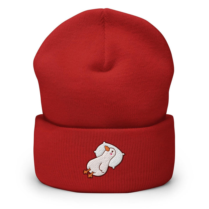 a red beanie with a polar bear on it