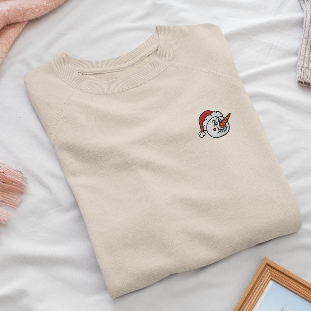 a white t - shirt with a unicorn embroidered on it