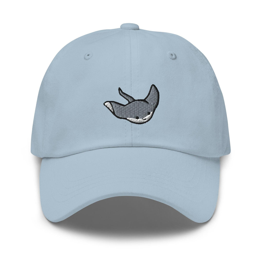 a light blue hat with a whale embroidered on it