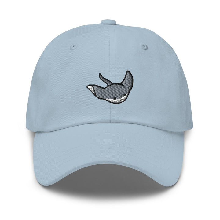 a light blue hat with a whale embroidered on it