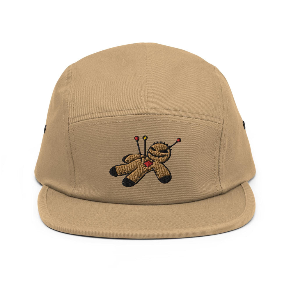 a tan hat with a teddy bear on it