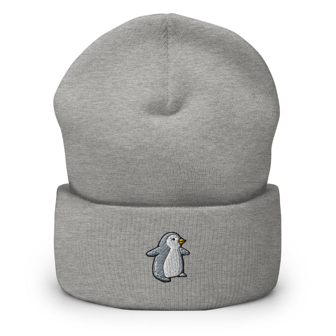 a grey beanie with a penguin on it