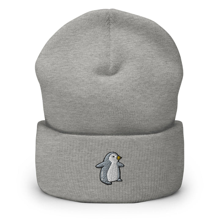 a grey beanie with a penguin on it
