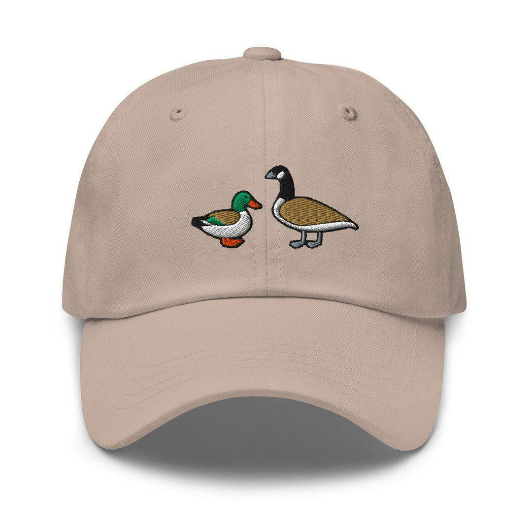 a beige hat with two ducks on it