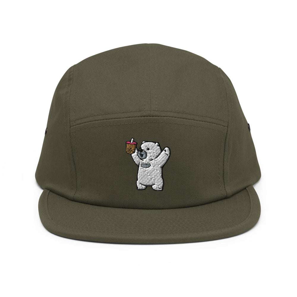 a green hat with a white bear holding an apple