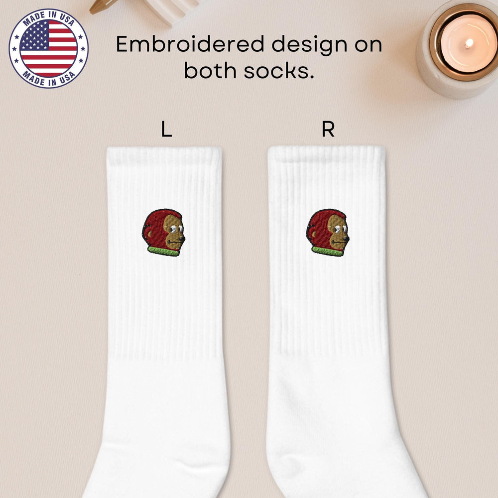 a pair of socks with a football helmet on them