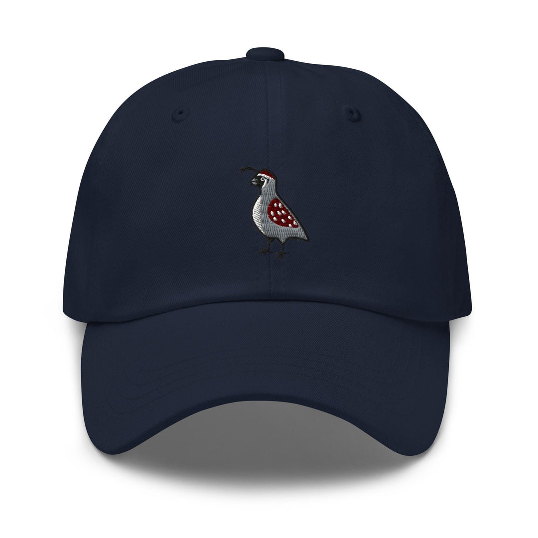 a blue hat with a bird embroidered on it