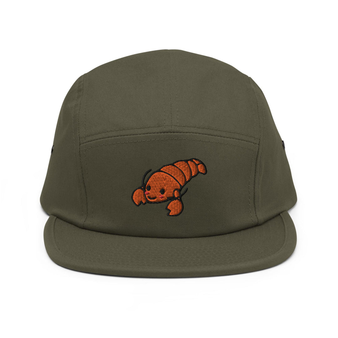 a green hat with an orange fish embroidered on it