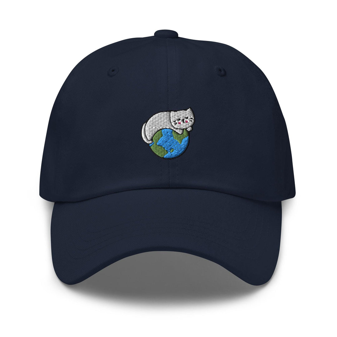 a baseball cap with a cat on top of the earth