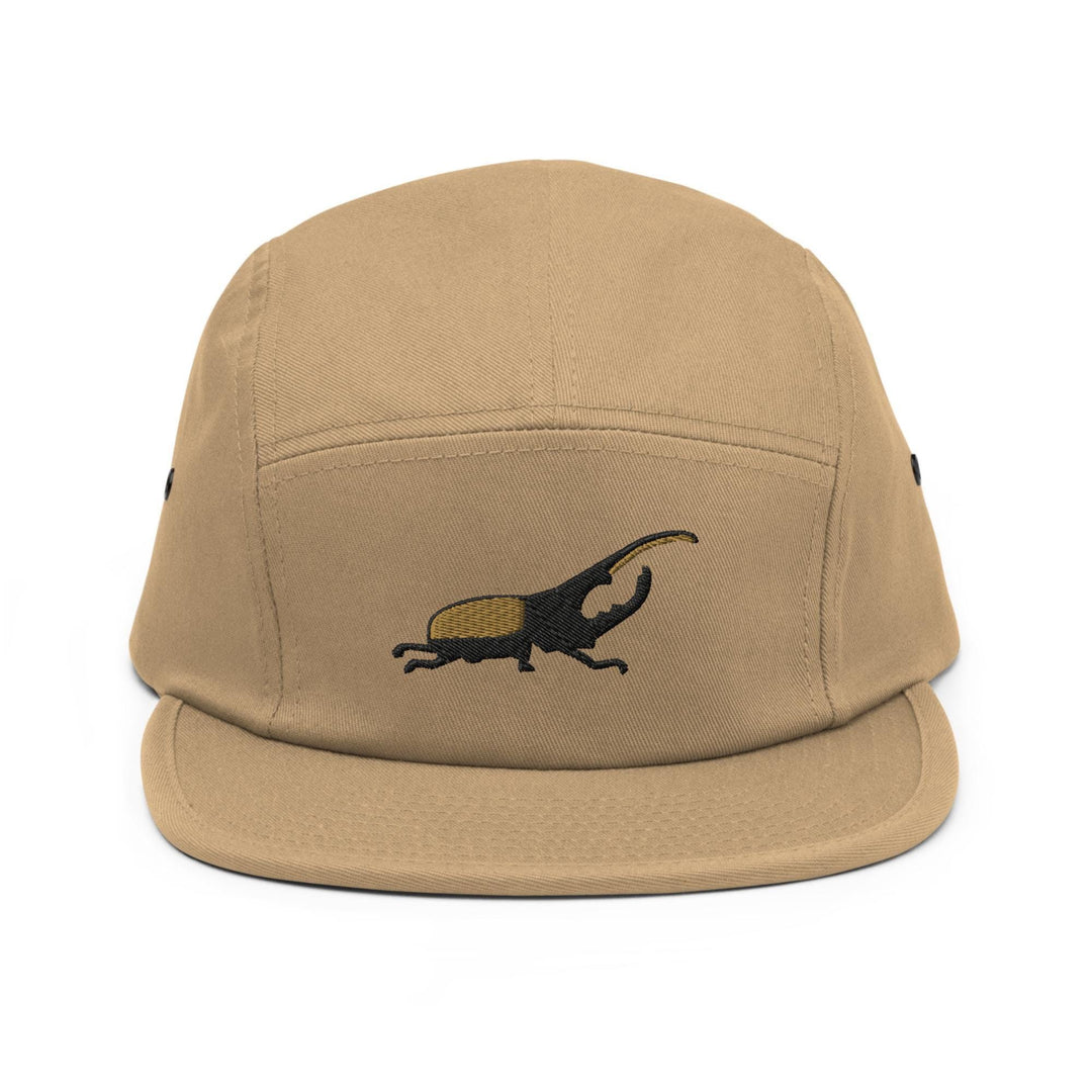 a brown hat with a lizard embroidered on it
